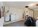 Garage interior with washer and dryer unit, and access to water heater, showing functionality and storage at 3139 Corona Dr, Holiday, FL 34690