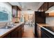 Wide view of the kitchen that shows the sink, counter, appliances, and dining area at 3139 Corona Dr, Holiday, FL 34690