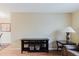 Cozy living room with dark console table and warm-toned walls, creating an inviting space at 3139 Corona Dr, Holiday, FL 34690