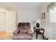 Comfortable living room with a recliner, side table, and accent lamp at 3139 Corona Dr, Holiday, FL 34690