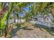 Backyard with a privacy fence and lush tropical landscaping at 3300 Jackson N St, St Petersburg, FL 33704