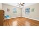 Bright, airy bedroom with wood floors and large windows at 3300 Jackson N St, St Petersburg, FL 33704
