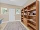 Entryway with built-in wooden shelving, natural light, and an inviting area rug at 3300 Jackson N St, St Petersburg, FL 33704