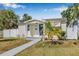 Charming single story home featuring well-maintained landscaping, a walkway, and neutral paint at 3300 Jackson N St, St Petersburg, FL 33704