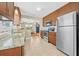 Modern kitchen featuring granite countertops, stainless steel appliances, and wood cabinetry at 3300 Jackson N St, St Petersburg, FL 33704