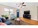 Well-lit living room with hardwood floors, neutral paint, and large windows at 3300 Jackson N St, St Petersburg, FL 33704
