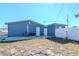 View of the backyard with a building on a concrete pad at 3445 Briar Cliff Dr, Holiday, FL 34691