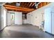 Unfinished basement with washer, dryer, and half bath at 3445 Briar Cliff Dr, Holiday, FL 34691