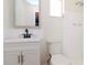 Bathroom with a white vanity and tile, featuring shower and toilet at 3445 Briar Cliff Dr, Holiday, FL 34691