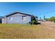 Charming single-story home with a well-maintained lawn and a classic blue exterior, perfect for suburban living at 3445 Briar Cliff Dr, Holiday, FL 34691