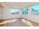 Open Living space with wood flooring and modern lighting at 3445 Briar Cliff Dr, Holiday, FL 34691