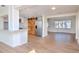 Open-concept living area and kitchen with modern finishes and plenty of natural light at 3445 Briar Cliff Dr, Holiday, FL 34691