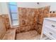 This is a detailed shot of the tiled shower featuring a built-in seat at 3445 Briar Cliff Dr, Holiday, FL 34691
