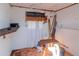 Unfinished storage area with wooden shelving and electrical outlets at 3445 Briar Cliff Dr, Holiday, FL 34691