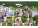 Aerial view of waterfront property featuring pool, boat dock, and solar panels at 3497 Coquina Key Se Dr, St Petersburg, FL 33705