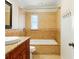 Elegant bathroom features a shower-tub combo, neutral tile, and granite countertop at 3497 Coquina Key Se Dr, St Petersburg, FL 33705
