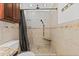 Bathroom features tiled shower and stone flooring at 3497 Coquina Key Se Dr, St Petersburg, FL 33705