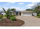 Charming single-story home with a well-manicured yard and brick driveway at 3497 Coquina Key Se Dr, St Petersburg, FL 33705