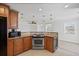 Kitchen featuring wooden cabinets, granite countertops, and a wine cooler at 3497 Coquina Key Se Dr, St Petersburg, FL 33705
