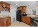 Traditional kitchen features a wine rack, granite countertops, and stainless appliances at 3497 Coquina Key Se Dr, St Petersburg, FL 33705
