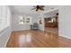 Living room with hardwood floors, ceiling fan, and natural light at 3497 Coquina Key Se Dr, St Petersburg, FL 33705