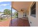 Covered patio with tile flooring, a ceiling fan, and views of the waterway and boats at 3497 Coquina Key Se Dr, St Petersburg, FL 33705