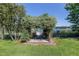 Outdoor seating beneath a floral arbor overlooking the tranquil lake at 3629 Lake Breeze Dr, Land O Lakes, FL 34639