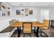 Cozy dining nook with a built-in bench, a table, and chairs for casual dining at 3629 Lake Breeze Dr, Land O Lakes, FL 34639