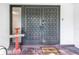 Stylish front door with a decorative welcome sign and a paved entryway at 3629 Lake Breeze Dr, Land O Lakes, FL 34639