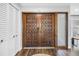 Elegant wooden double front doors with decorative hardware and sidelight window at 3629 Lake Breeze Dr, Land O Lakes, FL 34639