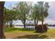 Lakeside gazebo offering a peaceful spot with picnic benches and scenic views at 3629 Lake Breeze Dr, Land O Lakes, FL 34639