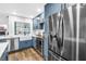 Bright kitchen with stainless steel appliances, farmhouse sink, and lake views at 3629 Lake Breeze Dr, Land O Lakes, FL 34639