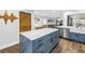 Kitchen showcases a marble island, custom cabinets, stainless appliances, and open floor plan at 3629 Lake Breeze Dr, Land O Lakes, FL 34639