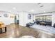 Bright and airy living room featuring hardwood floors and a large window at 3629 Lake Breeze Dr, Land O Lakes, FL 34639