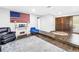 Spacious living room area with hardwood floors, stylish furniture and an accent wall at 3629 Lake Breeze Dr, Land O Lakes, FL 34639