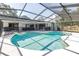 Enjoy the backyard views from this screened-in pool area with connected outdoor space at 3629 Lake Breeze Dr, Land O Lakes, FL 34639