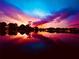 Colorful sunset reflecting on a tranquil lake, creating a serene and picturesque scene at 3629 Lake Breeze Dr, Land O Lakes, FL 34639