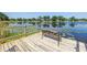 Scenic view of a lake featuring lily pads and houses in the background at 3629 Lake Breeze Dr, Land O Lakes, FL 34639