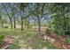 Relaxing backyard with mature trees, plants and natural landscape features at 371 Quane Ave, Spring Hill, FL 34609