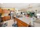 Open kitchen with stainless steel appliances and hardwood cabinets at 371 Quane Ave, Spring Hill, FL 34609