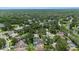 Aerial view showcasing a lush, established neighborhood dotted with mature trees and serene ponds at 3808 Hollow Wood Dr, Valrico, FL 33594