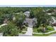 A beautiful home featuring lush landscaping and a long driveway on a well-manicured lawn at 3808 Hollow Wood Dr, Valrico, FL 33594