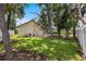 The backyard is an inviting outdoor space with a pool, lush landscaping, and mature trees at 3808 Hollow Wood Dr, Valrico, FL 33594