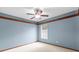 Bedroom featuring a ceiling fan, neutral walls, and a window at 3808 Hollow Wood Dr, Valrico, FL 33594