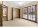 Bedroom with closet and access to a private balcony overlooking a pool area at 3808 Hollow Wood Dr, Valrico, FL 33594