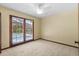 Bedroom featuring access to a private balcony overlooking a pool area at 3808 Hollow Wood Dr, Valrico, FL 33594