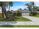 Charming single-Gathering home featuring manicured landscaping, a two-car garage, and inviting curb appeal at 3808 Hollow Wood Dr, Valrico, FL 33594