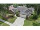 Charming single-Gathering home with a well-manicured lawn, an attached garage, and a neatly paved driveway at 3808 Hollow Wood Dr, Valrico, FL 33594