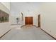 Inviting foyer with double doors, tile flooring, and a view into the formal living spaces at 3808 Hollow Wood Dr, Valrico, FL 33594