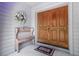 Inviting double front doors with bench and decorative wreath at 3808 Hollow Wood Dr, Valrico, FL 33594